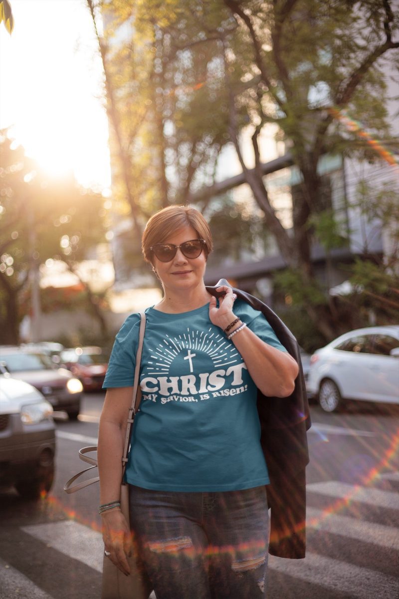 middle aged woman wearing a t shirt mockup carrying a jacket on her back a20719